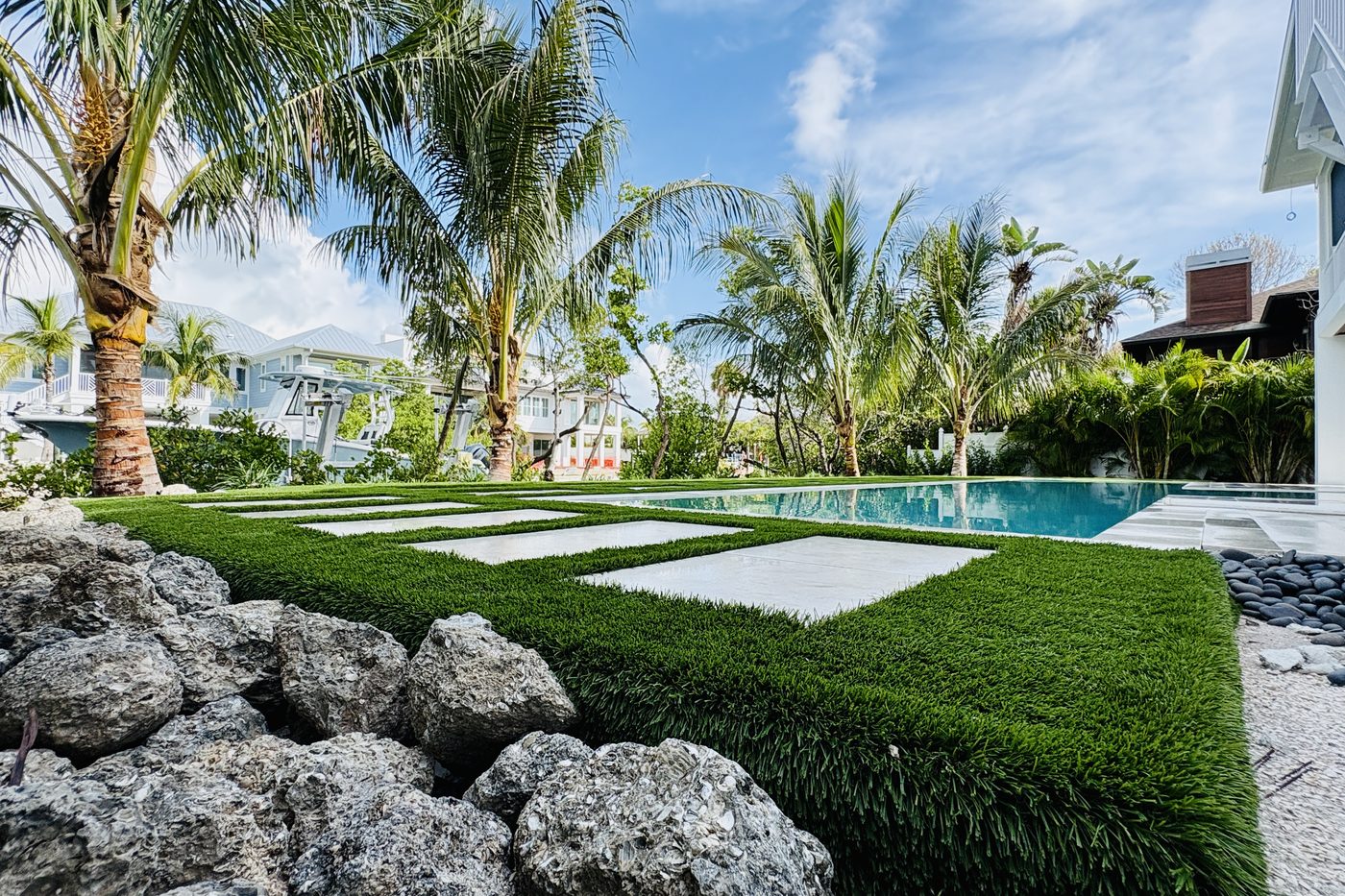 Custom paver walkway with tropical plantings
